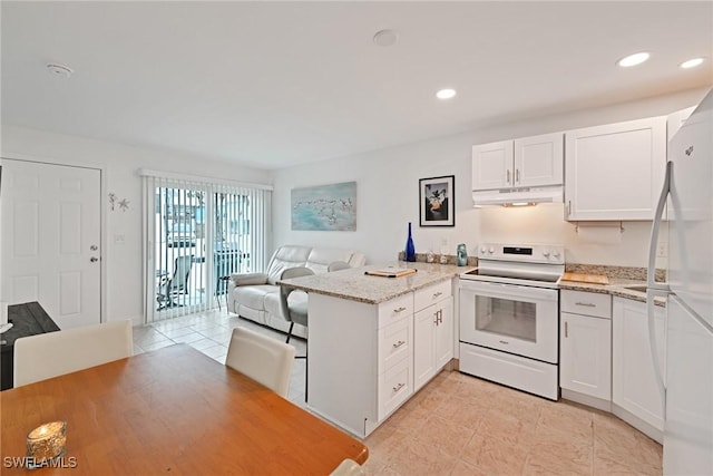 kitchen featuring white cabinetry, white appliances, and kitchen peninsula