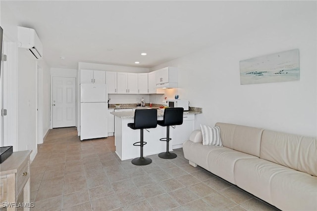 living room featuring a wall unit AC