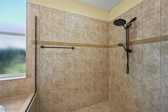 bathroom with a tile shower