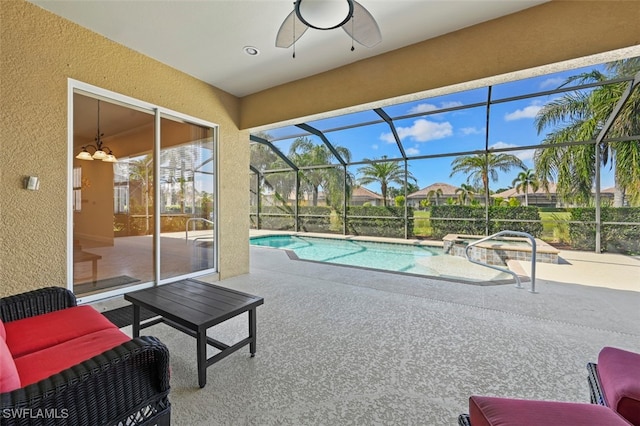 view of swimming pool featuring a patio area, glass enclosure, outdoor lounge area, an in ground hot tub, and ceiling fan