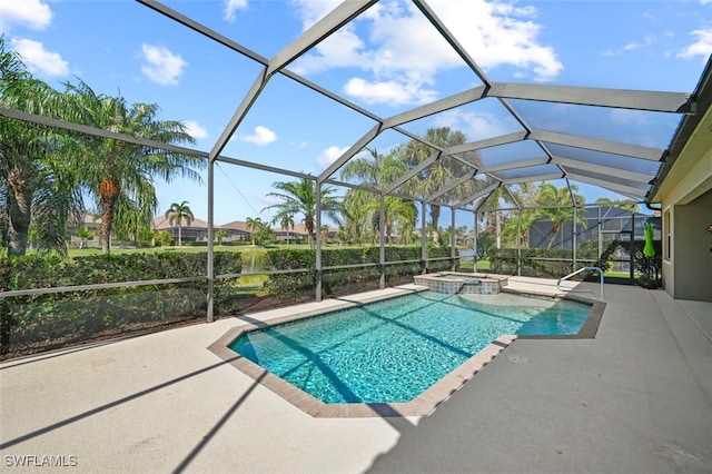 view of pool with an in ground hot tub, a patio area, and glass enclosure