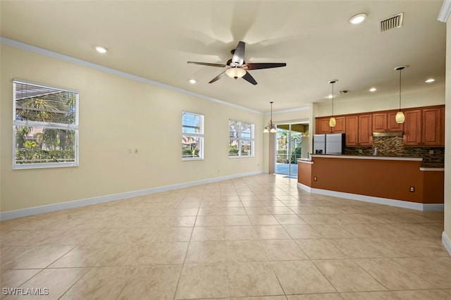 13230 Lazzaro Ct, Estero, FL 33928 - unfurnished living room with crown molding, recessed lighting, ceiling fan, light tile patterned flooring, and baseboards