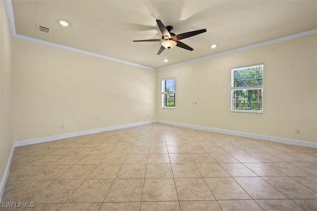 empty room with ornamental molding, ceiling fan, and light tile patterned flooring