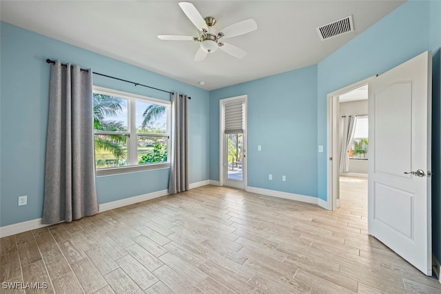 empty room featuring light hardwood / wood-style floors and ceiling fan