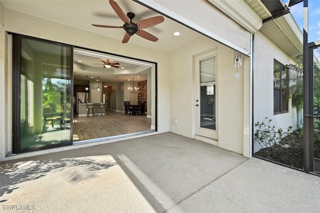 view of patio / terrace featuring ceiling fan