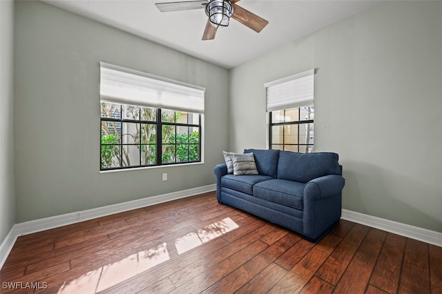 living room featuring hardwood / wood-style flooring, a healthy amount of sunlight, and ceiling fan