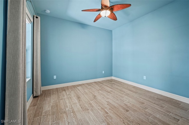 empty room with wood-type flooring and ceiling fan