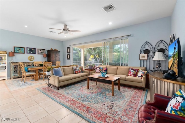 tiled living room with ceiling fan