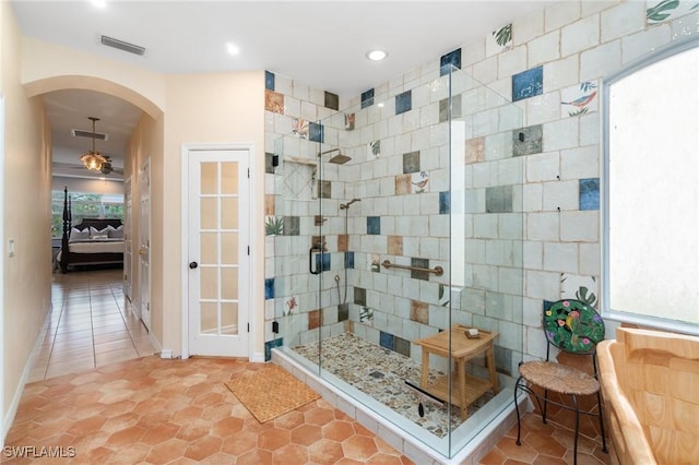 bathroom featuring tile patterned flooring and walk in shower