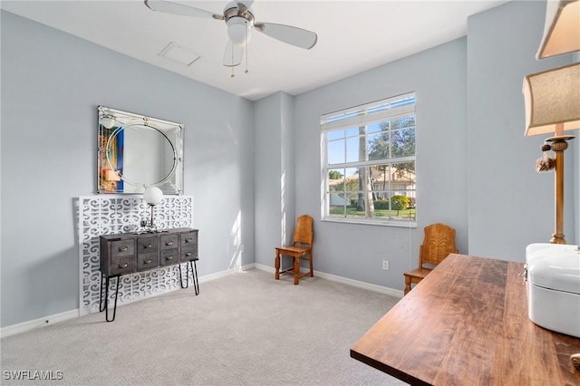 carpeted home office with ceiling fan