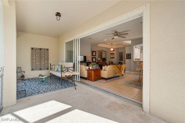 view of patio featuring ceiling fan