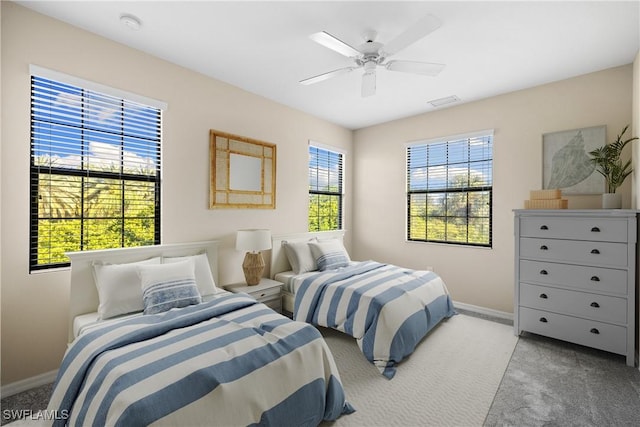 bedroom with light colored carpet and ceiling fan