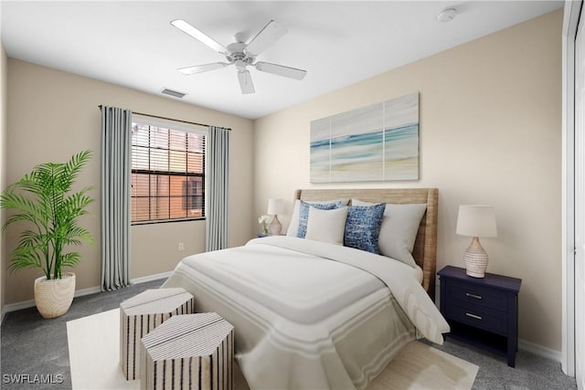 bedroom featuring ceiling fan and dark carpet