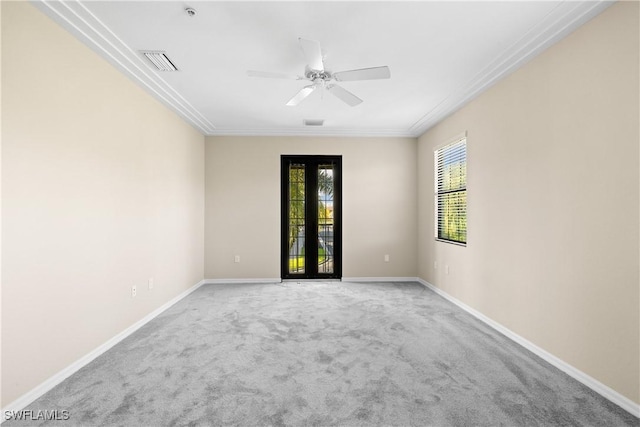 spare room with carpet floors, ceiling fan, and french doors