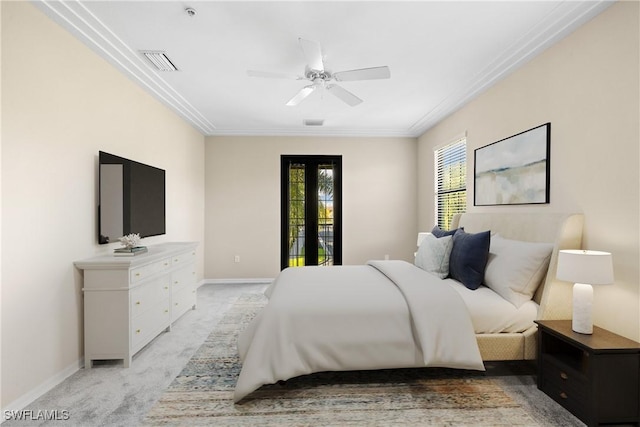 bedroom with ceiling fan, light carpet, and french doors