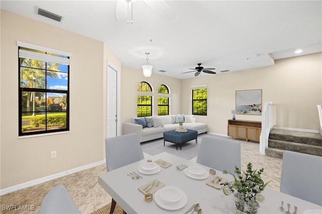 dining space featuring ceiling fan