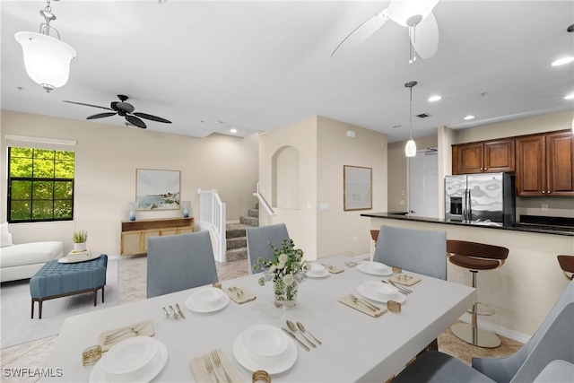 dining space featuring ceiling fan