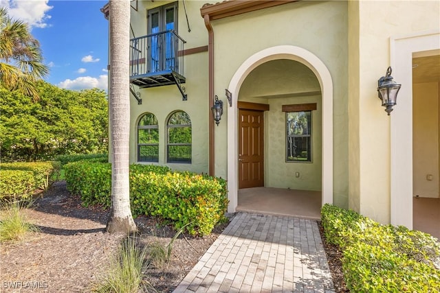 doorway to property featuring a balcony