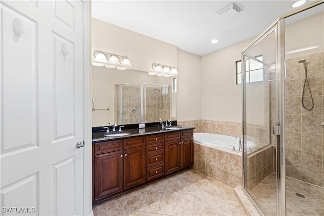 bathroom featuring separate shower and tub, tile patterned flooring, and vanity