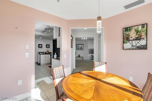 dining area with light tile patterned flooring