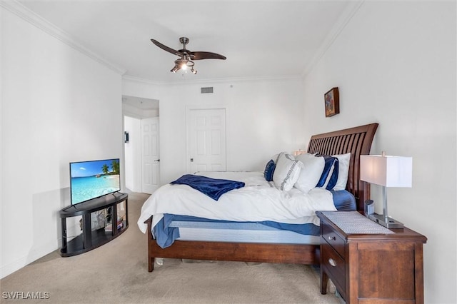 bedroom with light carpet, ceiling fan, and ornamental molding