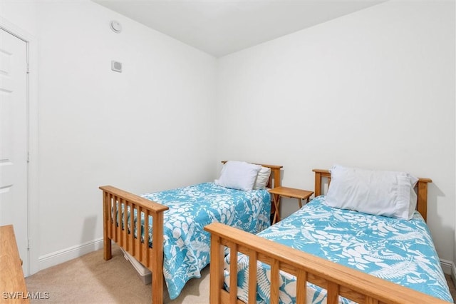 bedroom featuring light colored carpet