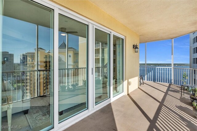 balcony featuring a water view