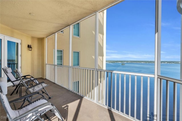 balcony featuring a water view