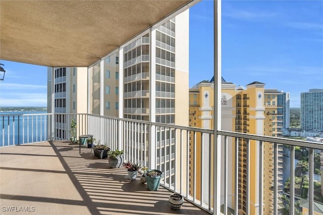 balcony featuring a water view