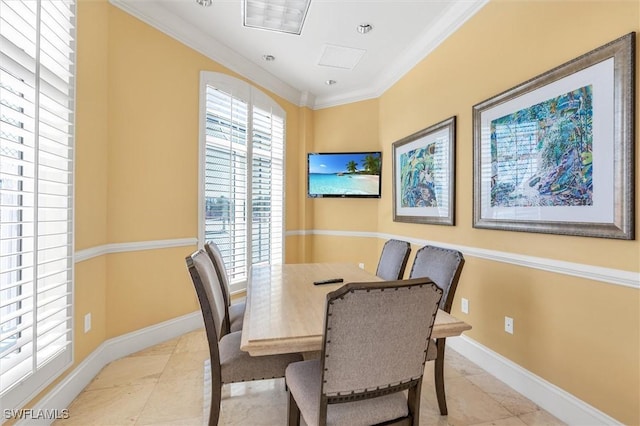 tiled dining area featuring ornamental molding