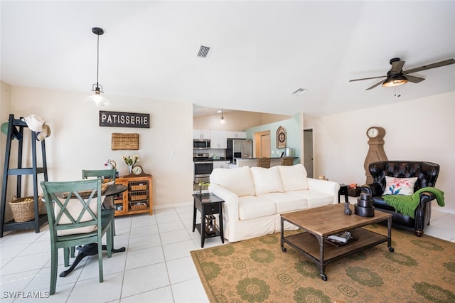 tiled living room featuring ceiling fan