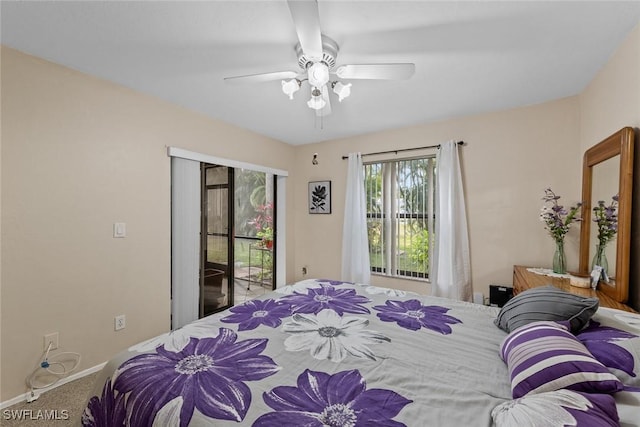 carpeted bedroom with ceiling fan and access to exterior