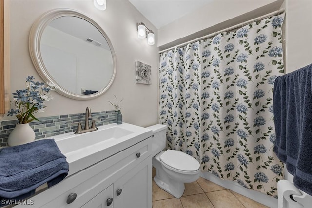 bathroom with visible vents, decorative backsplash, toilet, tile patterned floors, and vanity