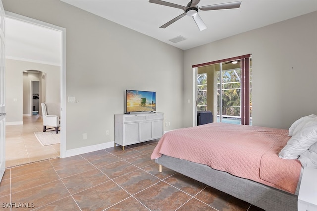 tiled bedroom with ceiling fan and access to exterior