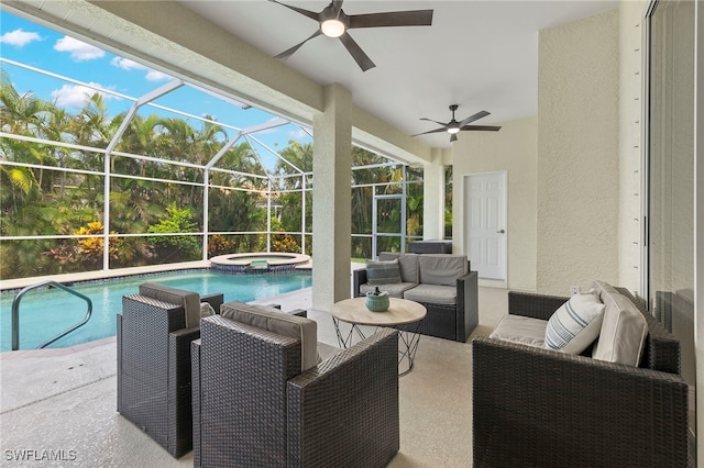 exterior space featuring an outdoor living space, glass enclosure, a pool with hot tub, and ceiling fan