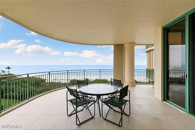 balcony featuring a water view