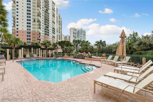 view of pool featuring a pergola and a patio