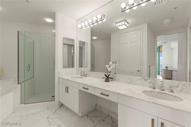 bathroom with vanity and an enclosed shower