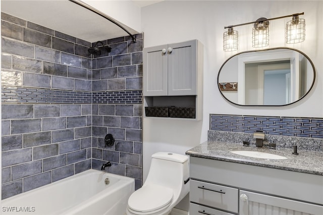 full bathroom featuring vanity, decorative backsplash, toilet, and tiled shower / bath combo