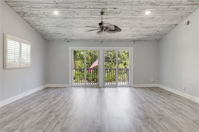 spare room featuring ceiling fan, lofted ceiling, wooden ceiling, and light hardwood / wood-style floors