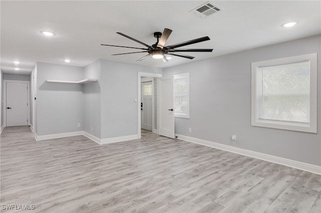 spare room featuring ceiling fan and light wood-type flooring