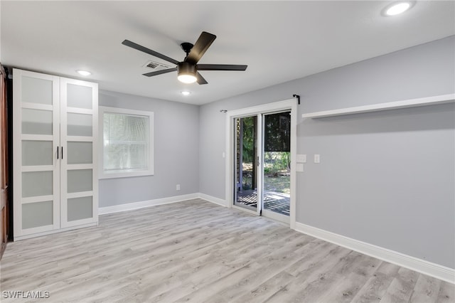 empty room featuring ceiling fan and light hardwood / wood-style floors