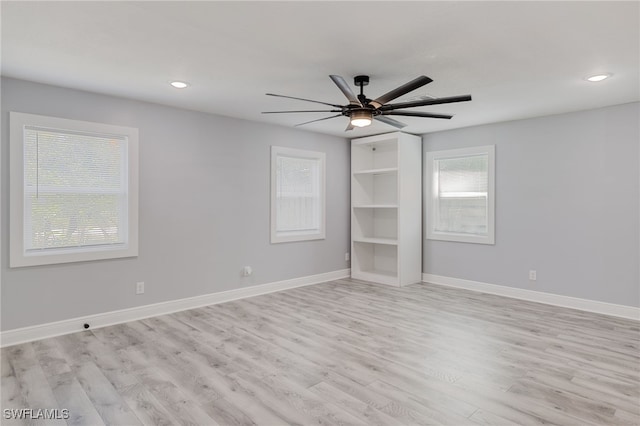 unfurnished bedroom featuring ceiling fan and light wood-type flooring