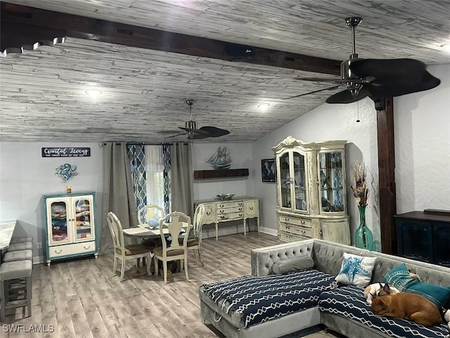 interior space featuring hardwood / wood-style flooring, ceiling fan, vaulted ceiling, and wooden ceiling