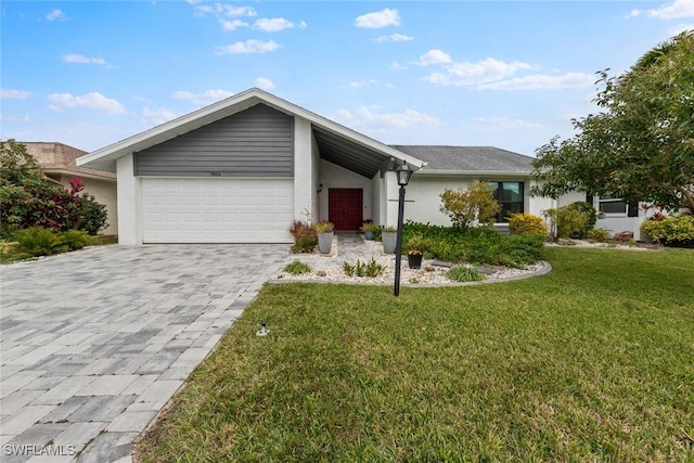 ranch-style home featuring a garage and a front yard