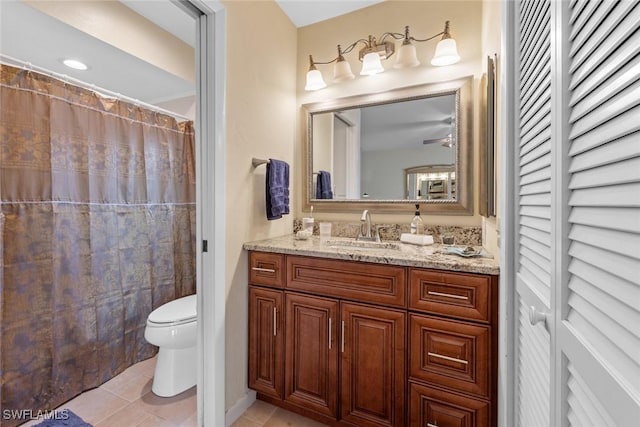 bathroom featuring tile patterned flooring, vanity, toilet, and a shower with shower curtain