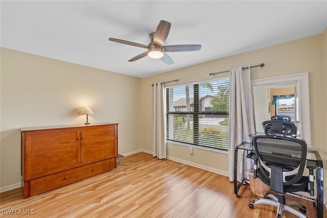 office space featuring ceiling fan and light hardwood / wood-style flooring