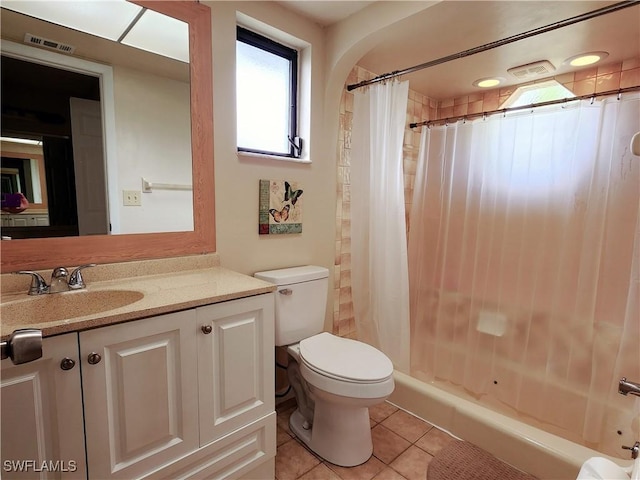 bathroom featuring tile patterned flooring, vanity, and toilet