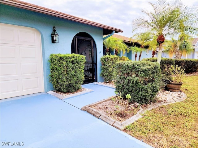 entrance to property featuring a garage