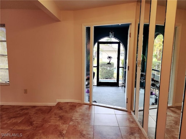 entrance foyer featuring tile patterned floors